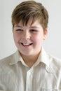 Portrait of smiling teenager boy in a bright shirt Royalty Free Stock Photo