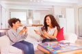 Brother and sister having fun playing card games Royalty Free Stock Photo