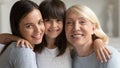 Portrait of smiling three generations of women hugging Royalty Free Stock Photo