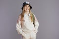 Portrait of smiling trendy teen girl in beige tracksuit Royalty Free Stock Photo