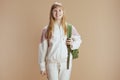 Portrait of smiling trendy teen girl in beige tracksuit Royalty Free Stock Photo