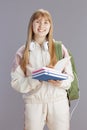 Portrait of smiling trendy teenage girl in beige tracksuit Royalty Free Stock Photo