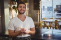Portrait of smiling waiter taking order Royalty Free Stock Photo