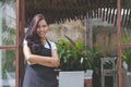 Waitress standing with arms crossed in cafe Royalty Free Stock Photo
