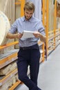 Portrait of a smiling warehouse keeper at work