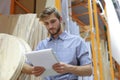 Portrait of a smiling warehouse keeper at work