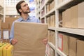 Portrait of a smiling warehouse keeper at work Royalty Free Stock Photo