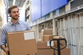 Portrait of a smiling warehouse keeper at work