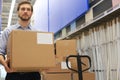 Portrait of a smiling warehouse keeper at work