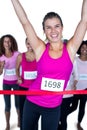 Portrait of smiling winner athlete crossing finish line Royalty Free Stock Photo