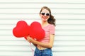 Portrait smiling woman with air balloons heart shape having fun Royalty Free Stock Photo