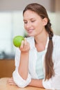 Portrait of a smiling woman with an apple Royalty Free Stock Photo