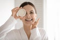 Portrait of smiling woman apply face cream Royalty Free Stock Photo
