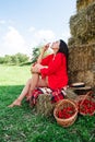 Portrait of Smiling Woman with Basket of Strawberries Royalty Free Stock Photo