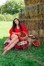 Portrait of Smiling Woman with Basket of Strawberries