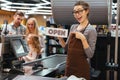 Portrait of smiling woman cashier