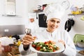 Woman chef serving fresh salad Royalty Free Stock Photo