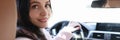 Portrait of smiling woman driver in car salon Royalty Free Stock Photo