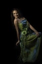 Portrait of smiling woman in green evening dress Royalty Free Stock Photo