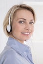 Portrait of smiling woman with headphone on telesales.
