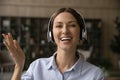 Portrait of smiling woman in headphones have webcam call Royalty Free Stock Photo