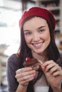 Portrait of smiling woman holding cupcake Royalty Free Stock Photo