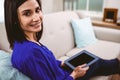Portrait of smiling woman holding digital tablet Royalty Free Stock Photo