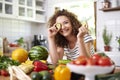 Woman holding a slice of cucumber Royalty Free Stock Photo