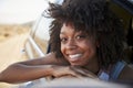 Portrait Of Smiling Woman Looking Out Of Car Window Enjoying Road Trip Royalty Free Stock Photo