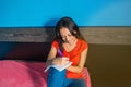 Portrait of a smiling woman making some notes in her diary related to her work. She has the inspiration Royalty Free Stock Photo