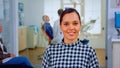 Portrait of smiling woman patient looking on webcam