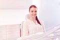 Portrait of smiling woman patient sitting on chair at clinic Royalty Free Stock Photo