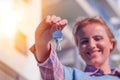 Crop close up of female tenant renter show praise house keys moving to first own new apartment or house. Rent, ownership concept Royalty Free Stock Photo