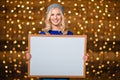 Portrait of a smiling woman showing blank board Royalty Free Stock Photo