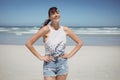 Portrait of smiling woman standing at beach Royalty Free Stock Photo