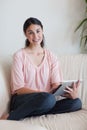 Portrait of a smiling woman using a tablet computer Royalty Free Stock Photo