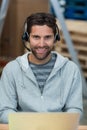 Portrait of a smiling worker wearing a headset Royalty Free Stock Photo