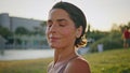 Portrait smiling yoga woman posing sunlight park at morning. Lady looking camera