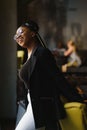 Portrait of a smiling young African American woman standing in front of her cafe with her arms crossed Royalty Free Stock Photo