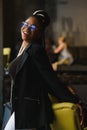 Portrait of a smiling young African American woman standing in front of her cafe with her arms crossed Royalty Free Stock Photo