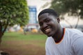 Portrait of a smiling young african boy during the sunset, handsome african person