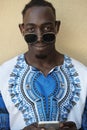 Portrait of a smiling young african man wearing traditioinal clothes