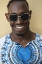 Portrait of a smiling young african man wearing traditioinal clothes