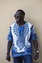 Portrait of a smiling young african man wearing traditioinal clothes