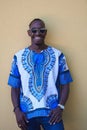 Portrait of a smiling young african man wearing traditioinal clothes