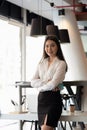 Portrait of smiling young asian business woman looking at the camera at office. Royalty Free Stock Photo