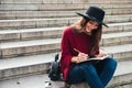 Portrait of a smiling young asian woman dressed in hat Royalty Free Stock Photo