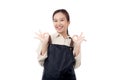 Portrait smiling young asian woman wearing apron showing ok sign with hand isolated white background. Royalty Free Stock Photo