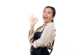 Portrait smiling young asian woman wearing apron showing ok sign with hand  white background. Royalty Free Stock Photo
