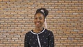 Portrait of smiling young black woman African American student studying from home and talking to her friends in webcam group Royalty Free Stock Photo